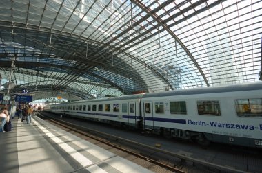 Train arriving in the Berlin's main train station clipart