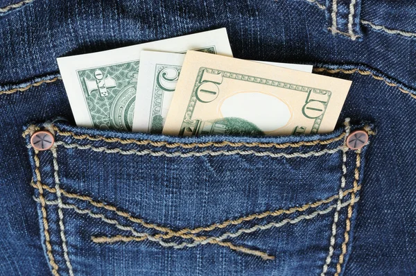 Denim jeans with money in the pocket — Stock Photo, Image