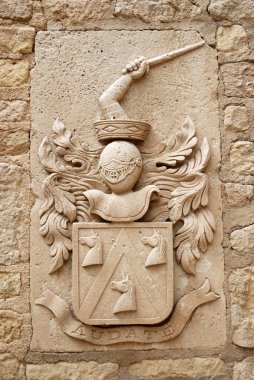 Medieval emblem in the Castle of Alicante clipart