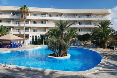 Swimming pool in a mediterranean resort clipart