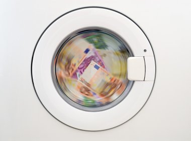 Money laundring in the washing machine clipart