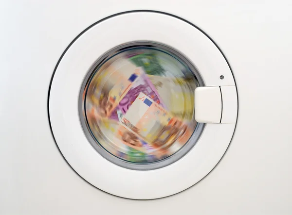 Pengar laundring i tvättmaskinen — Stockfoto
