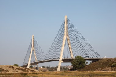 Suspension bridge over the Guadiana river, Algarve Portugal clipart