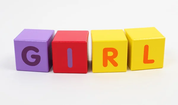 Palavra menina escrita com cubos alfabeto colorido — Fotografia de Stock