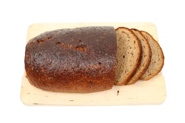 Brödlimpa på skärbräda — Stockfoto