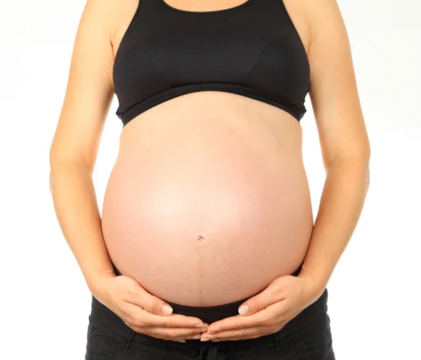 Young pregnant woman holds her belly — Stock Photo, Image