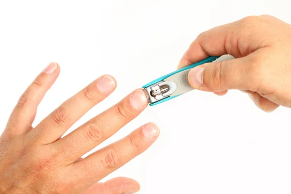 Male person cutting finger nails — Stock Photo, Image