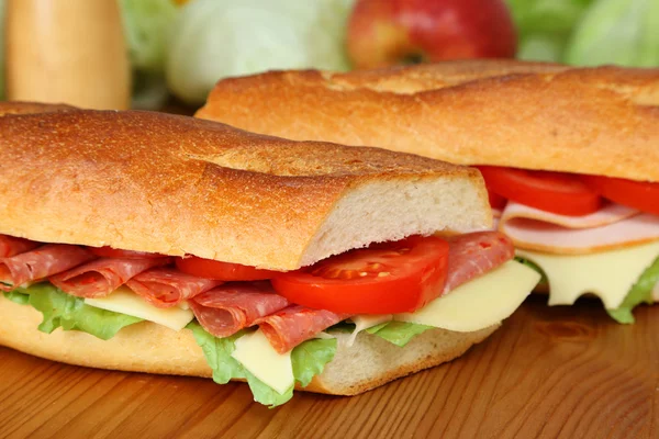Fresh sandwich with salami, cheese and tomatoes — Stock Photo, Image