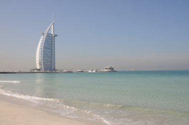 Jumeirah Beach and Hotel Burj Al Arab in Dubai clipart