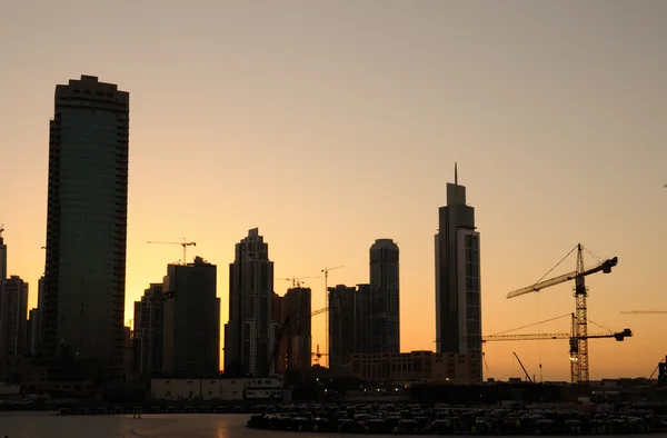 Skyscrapers construction site at sunset — Stock Photo, Image