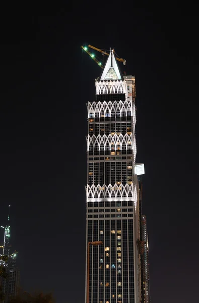Skyscraper in Dubai city at night — Stock Photo, Image