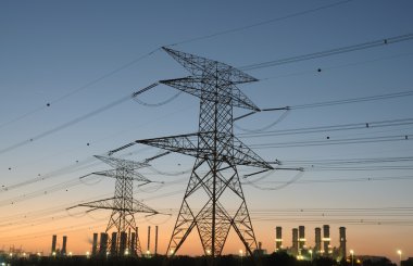 Power Pole and Electricity Station in background at sunset clipart