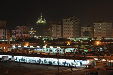 Fish market in Sharjah City at night. clipart