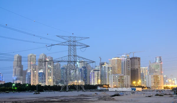 stock image Electrical Tower and Dubai City in the background