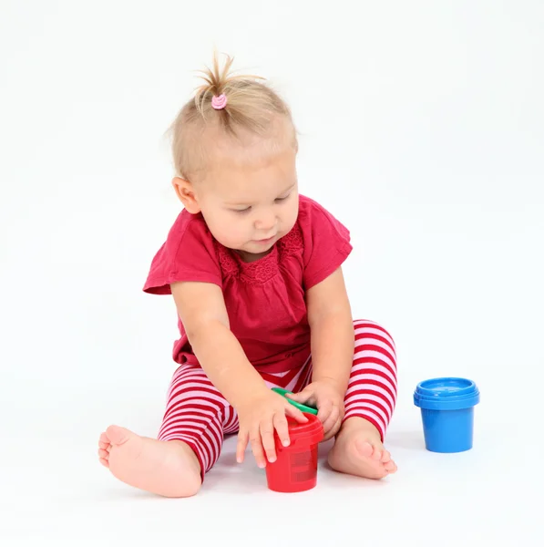 Cute toddler girl playing with painting colors — Stock Photo, Image