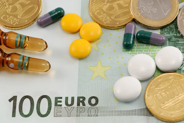 Pills on European currency. Concept of medicating an injured economy — Stock Photo, Image