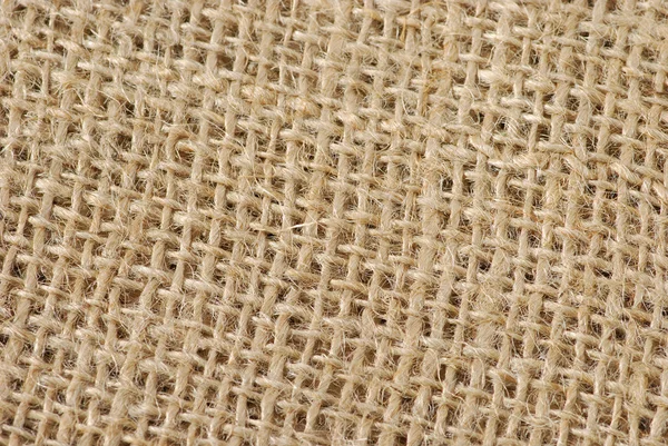 砂茶色黄麻布の織り目加工の背景 — ストック写真