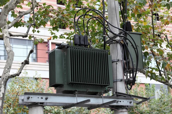 High voltage transformer in the city — Stock Photo, Image