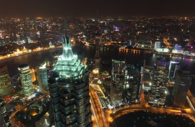Aerial view over the megacity Shanghai at night clipart