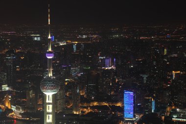 Oriental Pearl Tower and Shanghai at night clipart