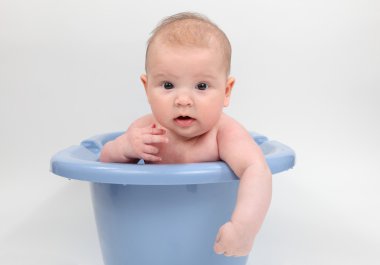 Three month old baby in a bathtub clipart