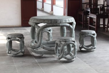 Ancient stone table and chairs in Chinese Temple clipart