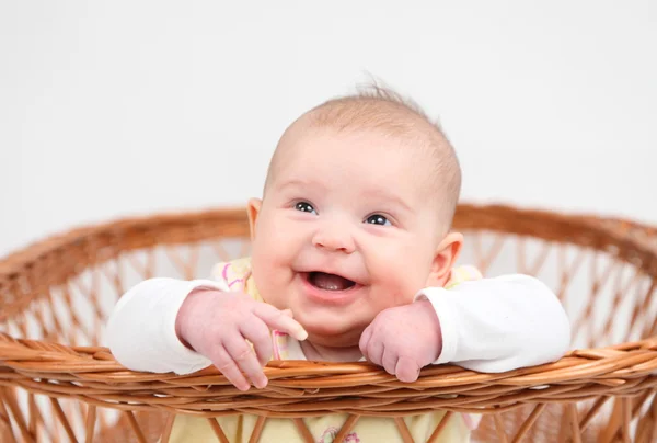 Little baby girl in basket — Stock Photo, Image
