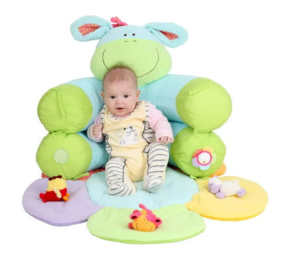 Bebé en un colorido asiento infantil —  Fotos de Stock