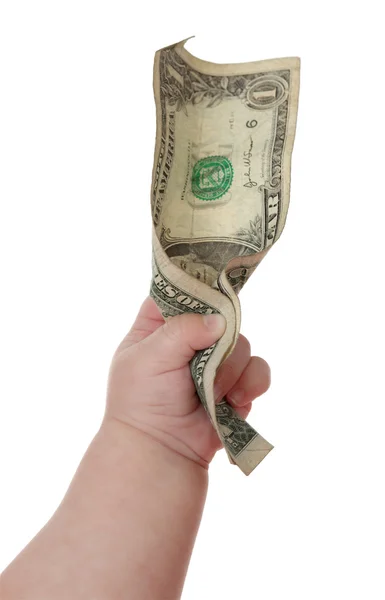 Mão de bebê segurando um dólar . — Fotografia de Stock
