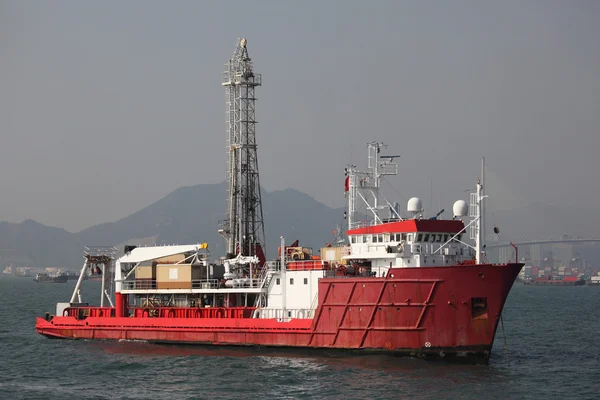 Red oil drilling ship in harbor — Stock Photo, Image