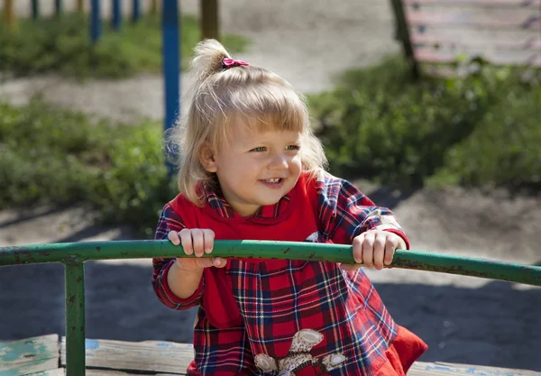 Adorable little girl having fun on a swing — Stock Photo, Image