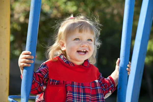 stock image Adorable little girl having fun on a swing