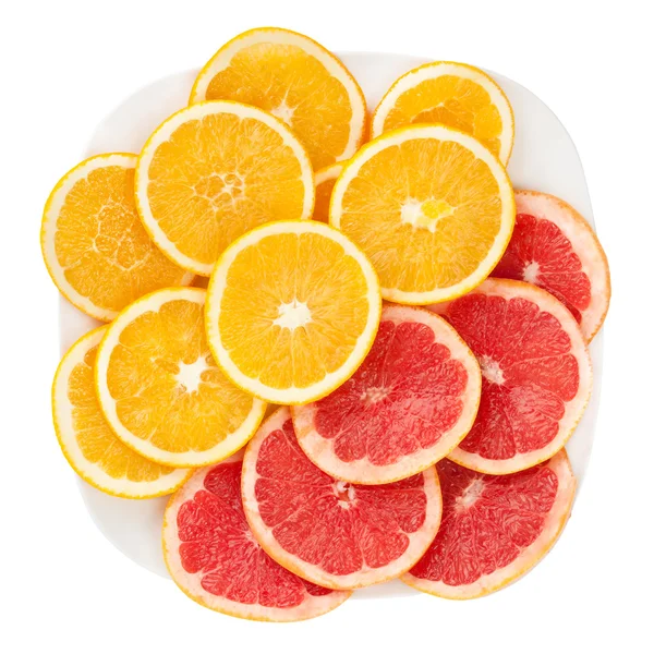 Грейпфрут и апельсин на тарелке — стоковое фото