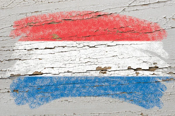 Flag of Netherlands on grunge wooden texture painted with chalk — Stock Photo, Image