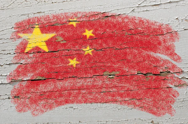 Flag of China on grunge wooden texture painted with chalk — Stock Photo, Image