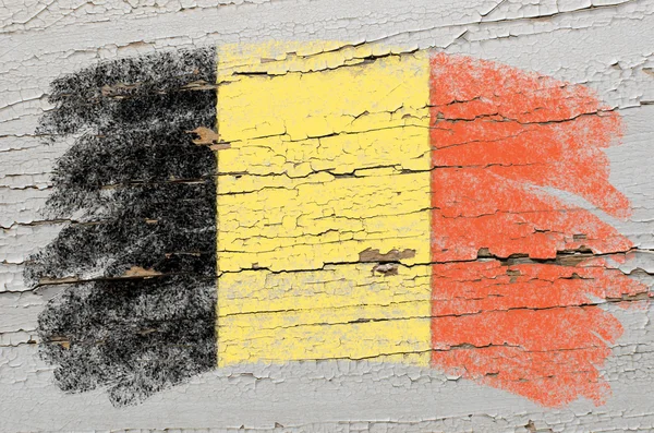 Flag of Belgium on grunge wooden texture painted with chalk — Stock Photo, Image