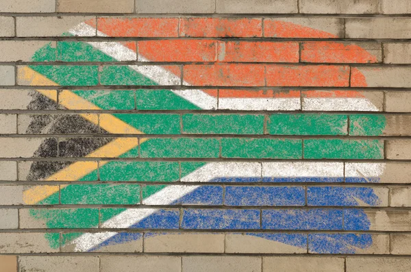Flag of South Africa on grunge brick wall painted with chalk — Stockfoto