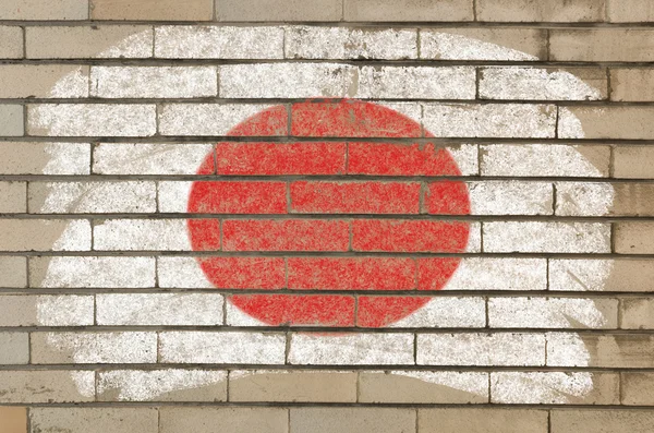 Bandiera del Giappone su muro di mattoni grunge dipinta con gesso — Foto Stock
