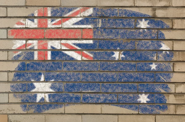 Australias flagg på mursteinsvegg malt med kritt – stockfoto