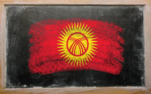 Flag of kyrghyzstan on blackboard painted with chalk — Stock Photo, Image