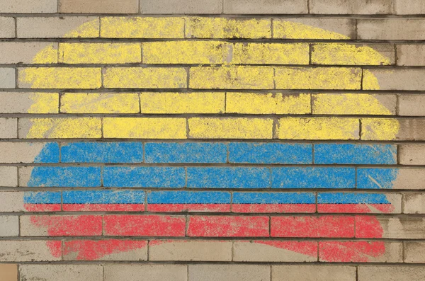Vlajka Kolumbie na grunge cihlové zdi namalované křídou — Stock fotografie