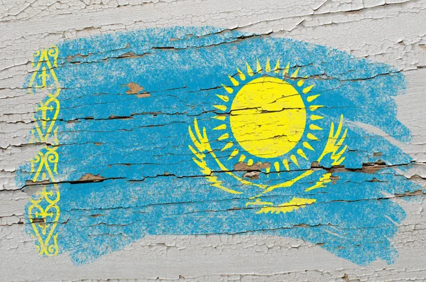 Flag of khazakstan on grunge wooden texture painted with chalk — Stock Photo, Image