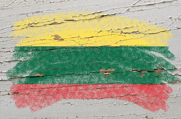 Flag of lithuania on grunge wooden texture painted with chalk — Stock Photo, Image