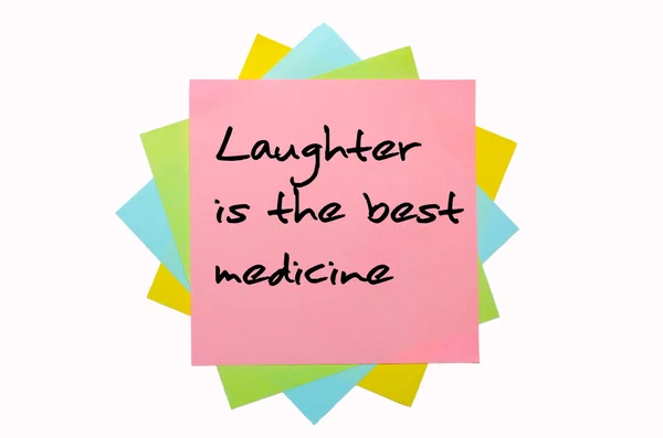 Atasözü "kahkaha en iyi ilaç olduğunu" stic bir demet yazılmış — Stok fotoğraf