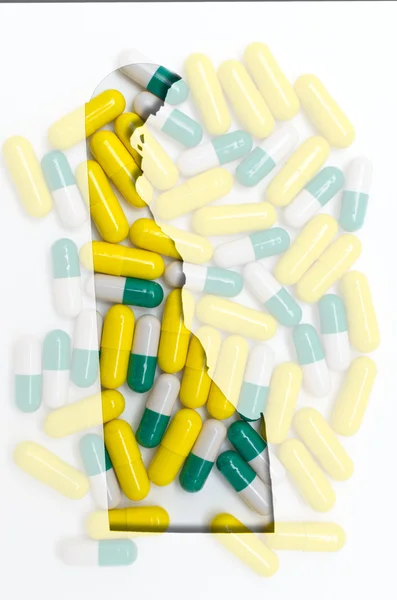 Konturkarta delaware över med transparent piller i bakgrunden — Stockfoto