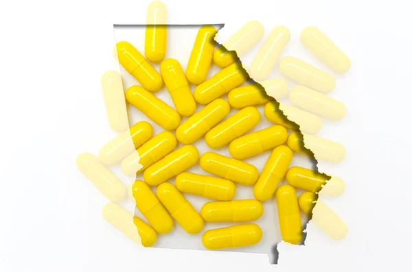 Mapa do esboço de Geórgia com pílulas transparentes em segundo plano — Fotografia de Stock