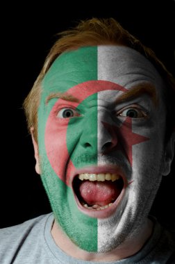 Face of crazy angry man painted in colors of algeria flag clipart