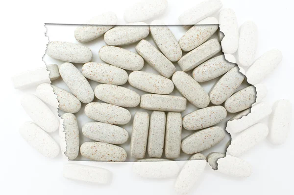 Umrisskarte von Joghurt mit transparenten Pillen im Hintergrund — Stockfoto