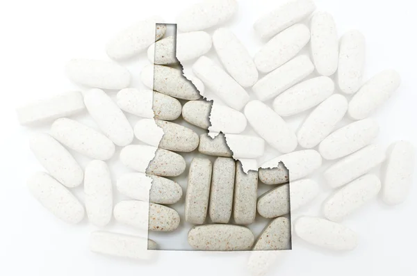 Mapa do esboço de Idaho com pílulas transparentes no fundo — Fotografia de Stock