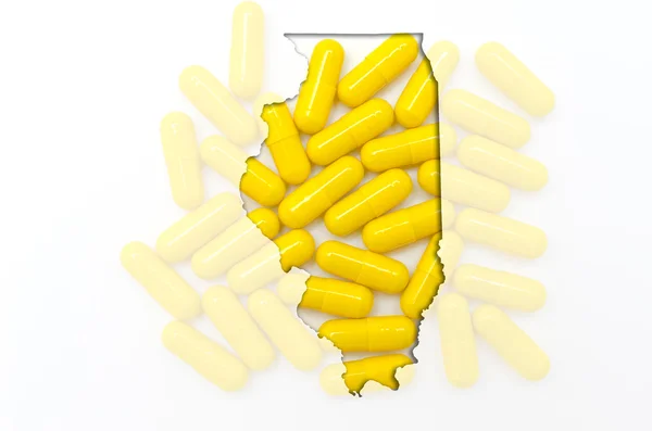 Outline map of Illionis with transparent pills in the background — Stock Photo, Image